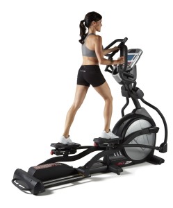 Woman Using Elliptical Trainer