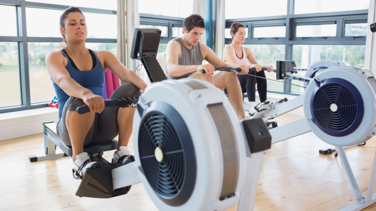 3 People Using A Rowing Machine