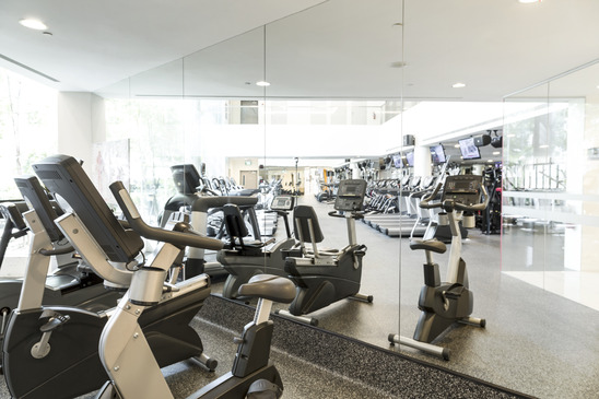 An interior shot of a club gym with all the exercise equipment