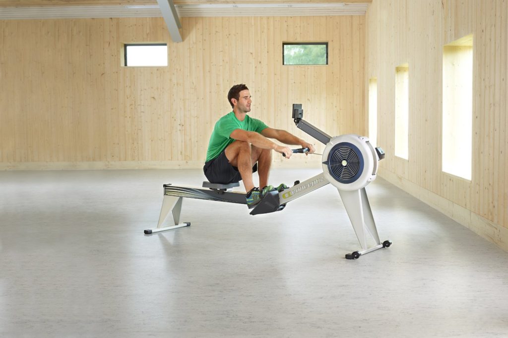 Man Using Concept 2 Model E Rowing Machine