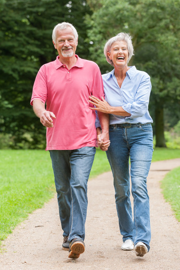 A Couple Walking In The Park