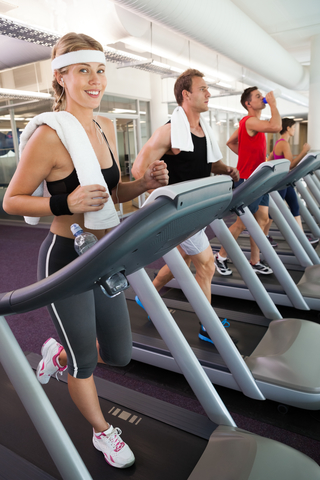 People Working Out On Treadmills