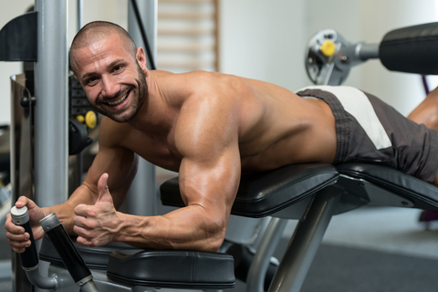 Man Doing Lying Leg Curls On Leg Day