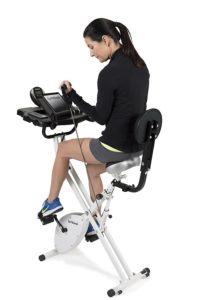 Woman Using Resistance Bands On FitDesk Bike