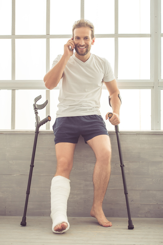 Photo of a man with a broken leg