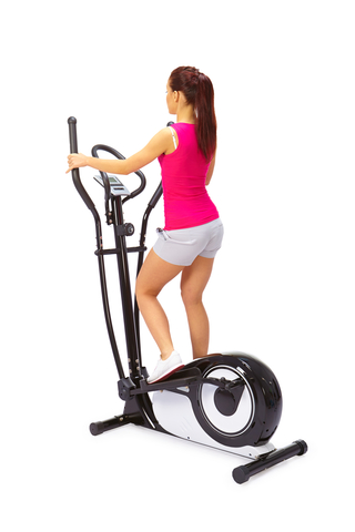 woman using elliptical cross trainer