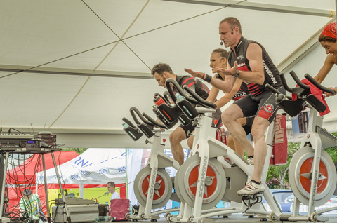 Instructor Leading Group Cycling Class